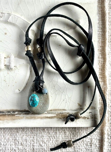 Beach rock with turquoise bead and labradorite bead on black leather lace