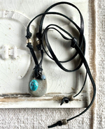Beach rock with turquoise bead and labradorite bead on black leather lace