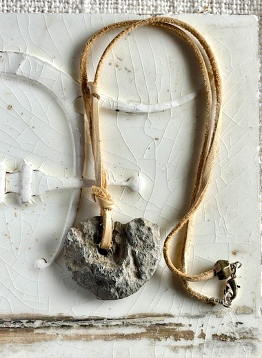 Ammonite on light brown leather