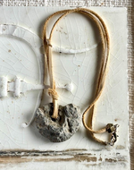 Ammonite on light brown leather