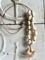 Ammonite with elk bone beads on leather cord